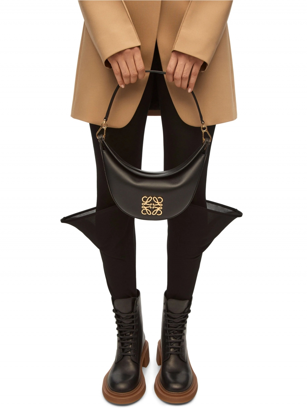 以手拎著Small LOEWE Luna Bag in Satin Calfskin。