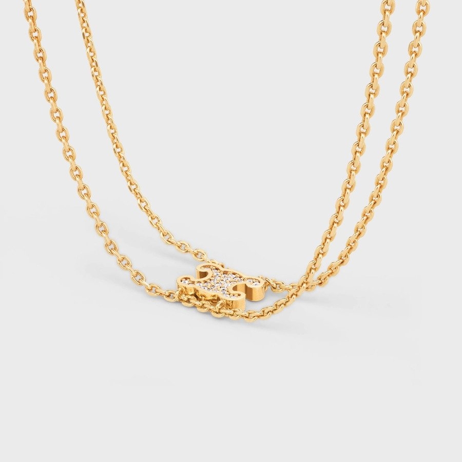 綴有品牌經典的凱旋門標誌並飾以水晶水鑽。