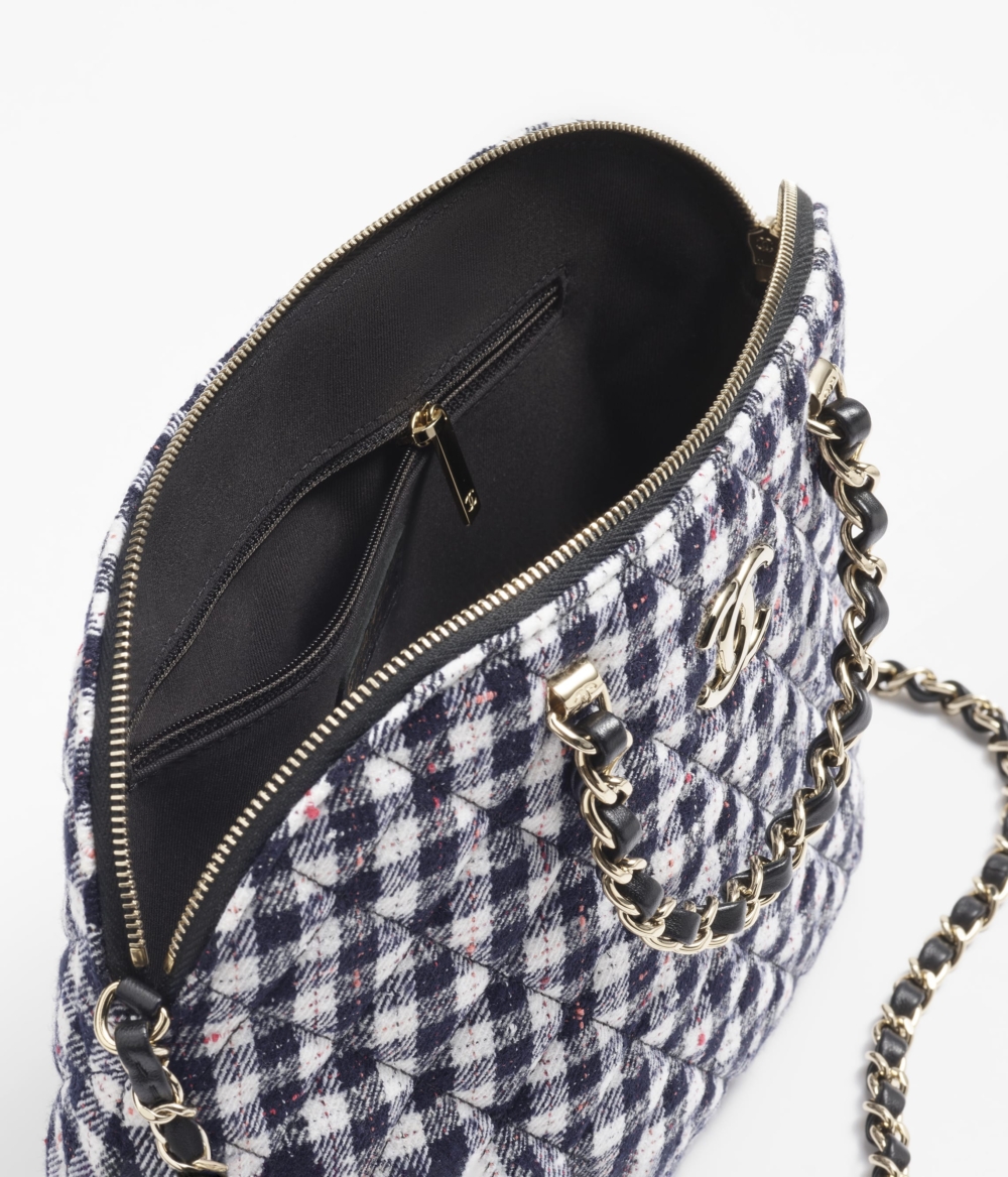 手袋配有金屬交織皮革的鏈條背帶。