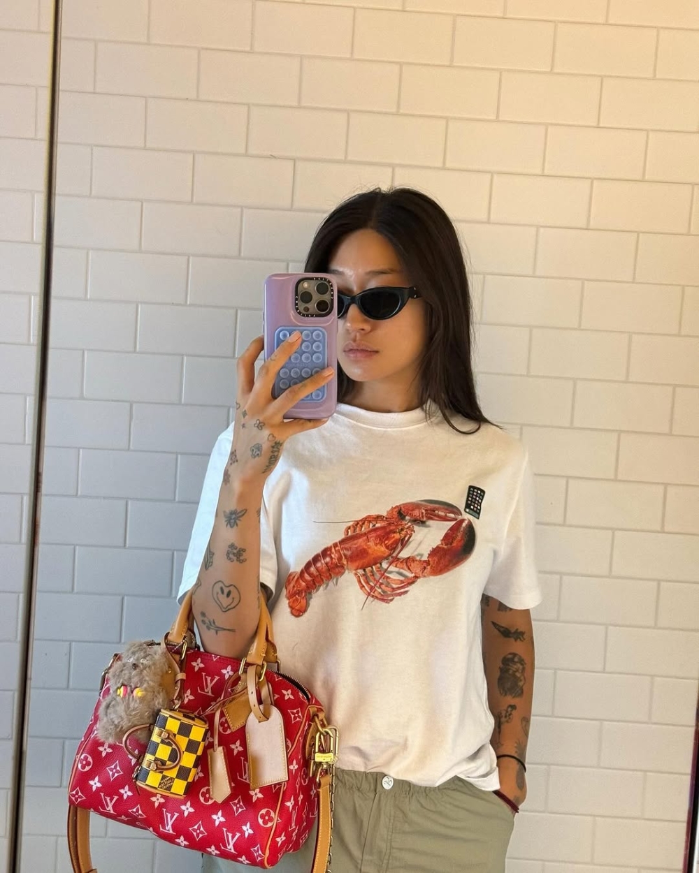 Peggy的照片中最常出現的就是經典的Speedy Bag