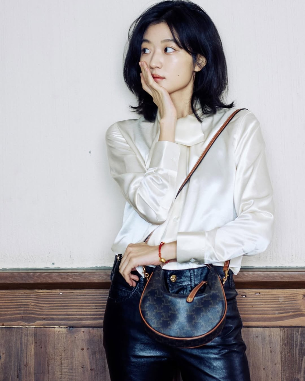 LULU手袋最引人注目的，莫過於它那流暢的圓弧外型