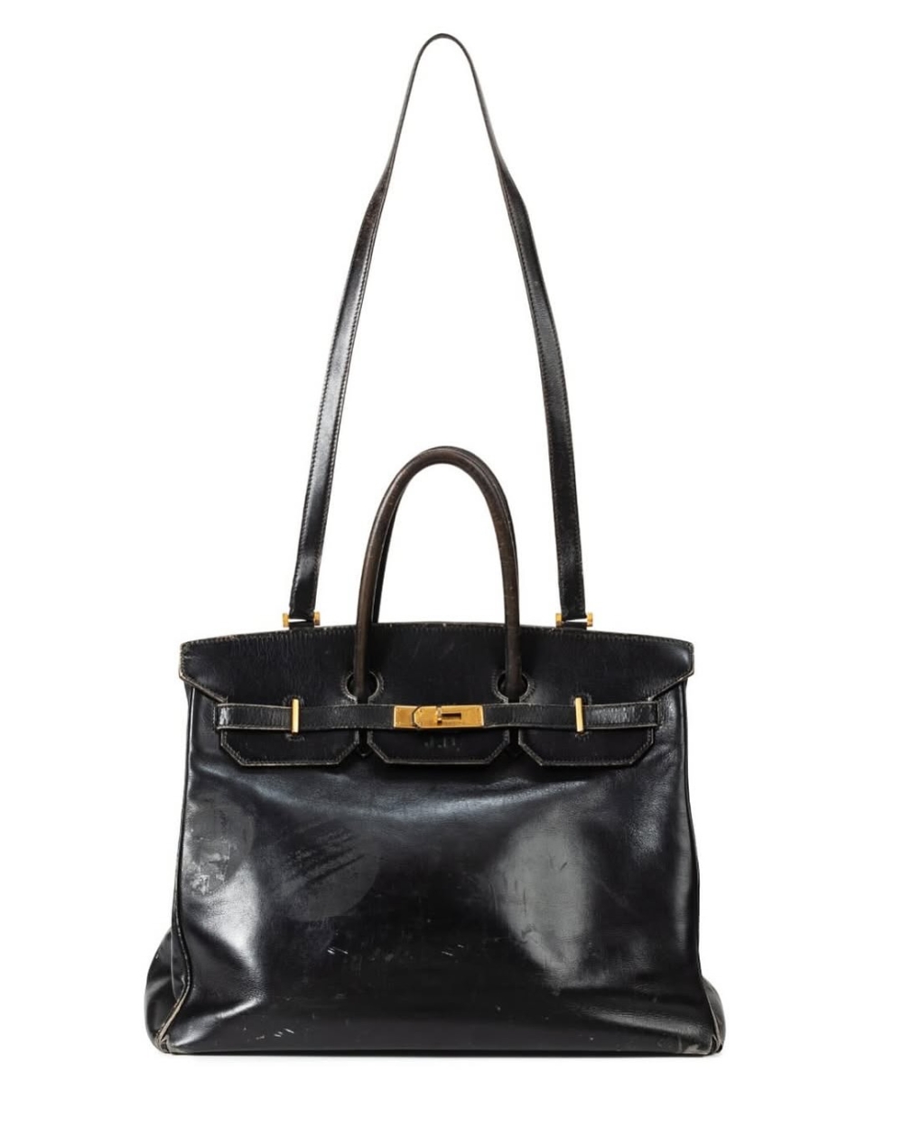 舊得脫皮、黑色皮革、刻著「JB」縮寫的柏金包