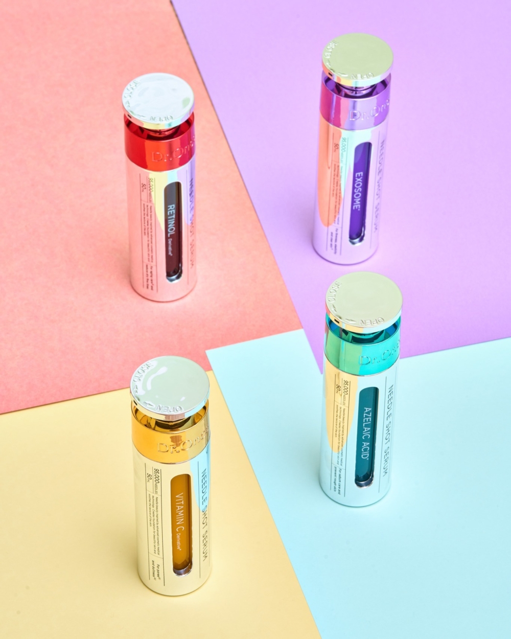 Dr.Once 微針精華系列，包含紅色 A 醇、紫色外泌體、黃色維他命 C 與藍綠色杜鵑花酸四款金屬瓶身產品，展示於多彩幾何背景上