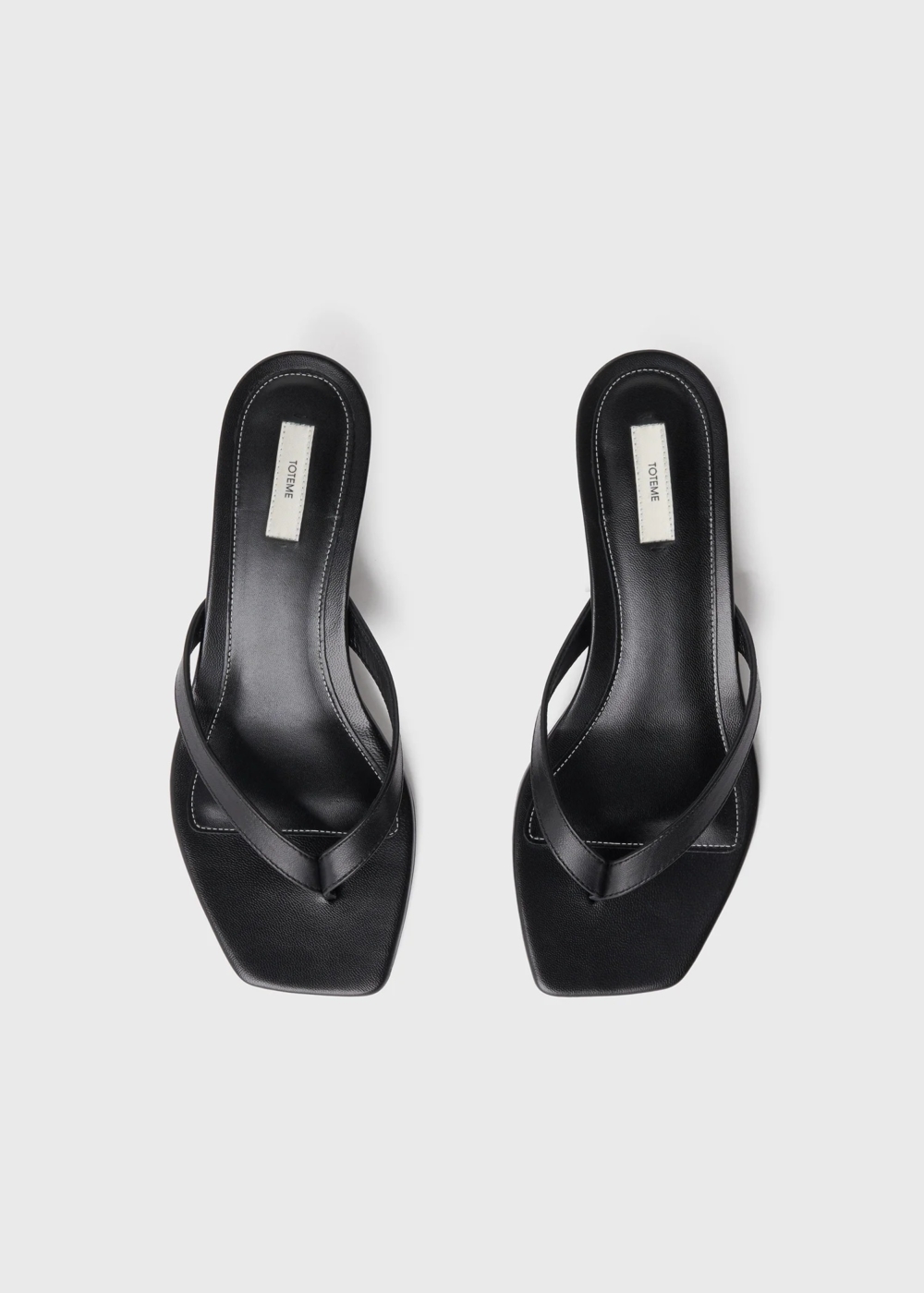 TOTEME Leather heeled flip flops black
